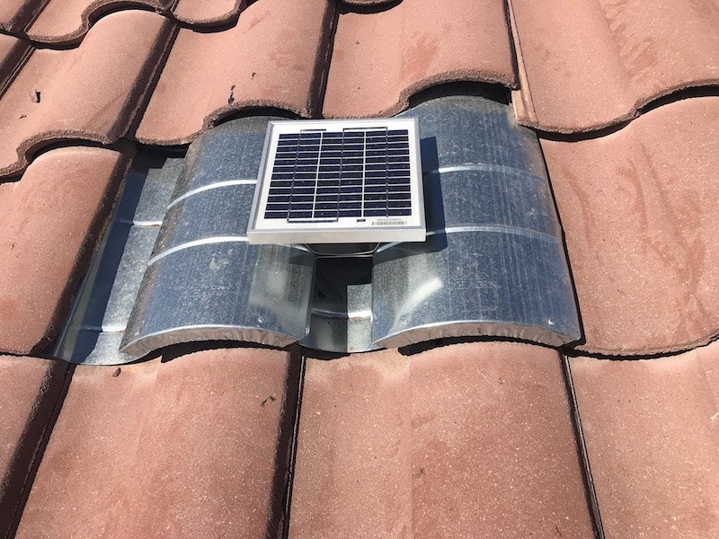 Solar S-TileBlaster installed on a roof that uses "S" style O'Hagin vent. The vent has not been painted yet to match the rest of the tiles.
