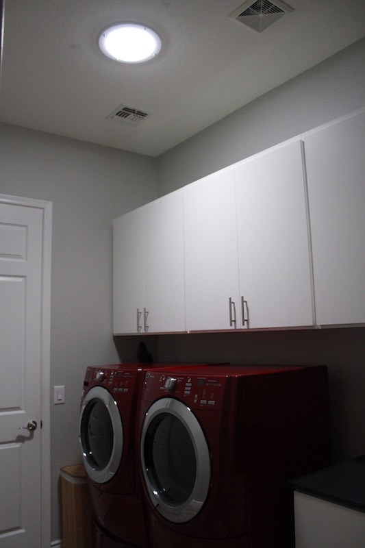 laundry room with ECOMAX tube skylight installed in it