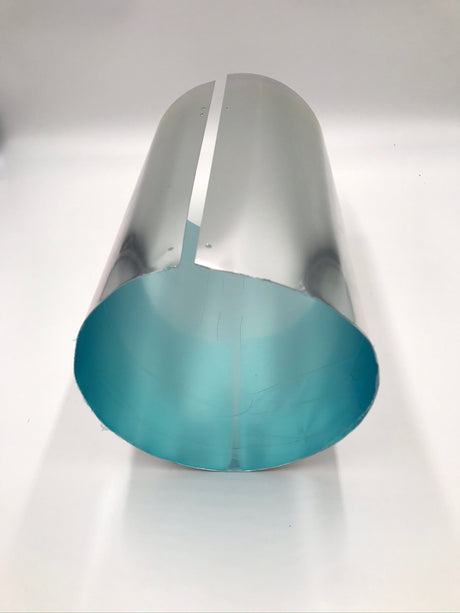 12 inch extension tube laying on its side and showing the blue protective film that is on the inside of the tube. This protective layer needs to be removed prior to installation.