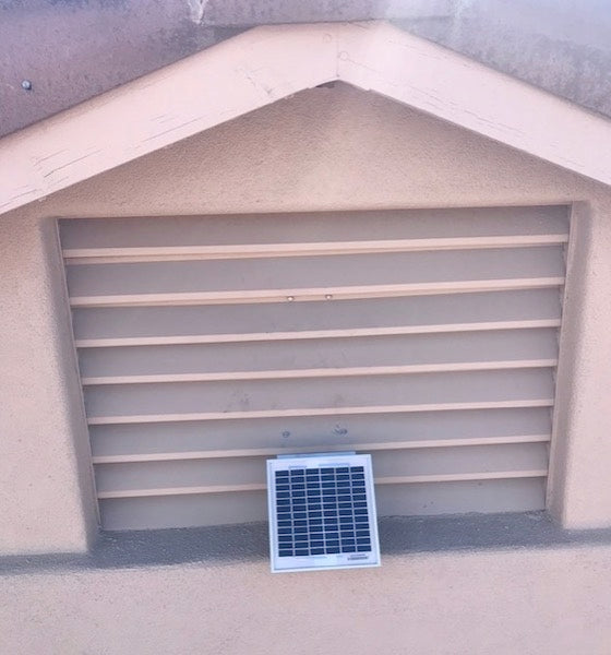 Solar Metal RidgeBlaster installed on the sunny side of a gable vent