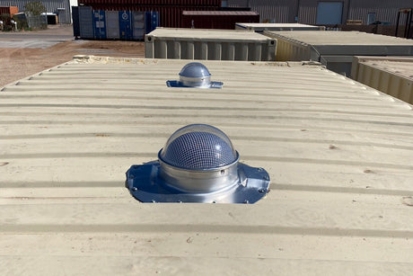 Two Conex Solar LightBlaster installed on a biege shipping container's roof which has 3.5" ribs. This is a customer's install photo.