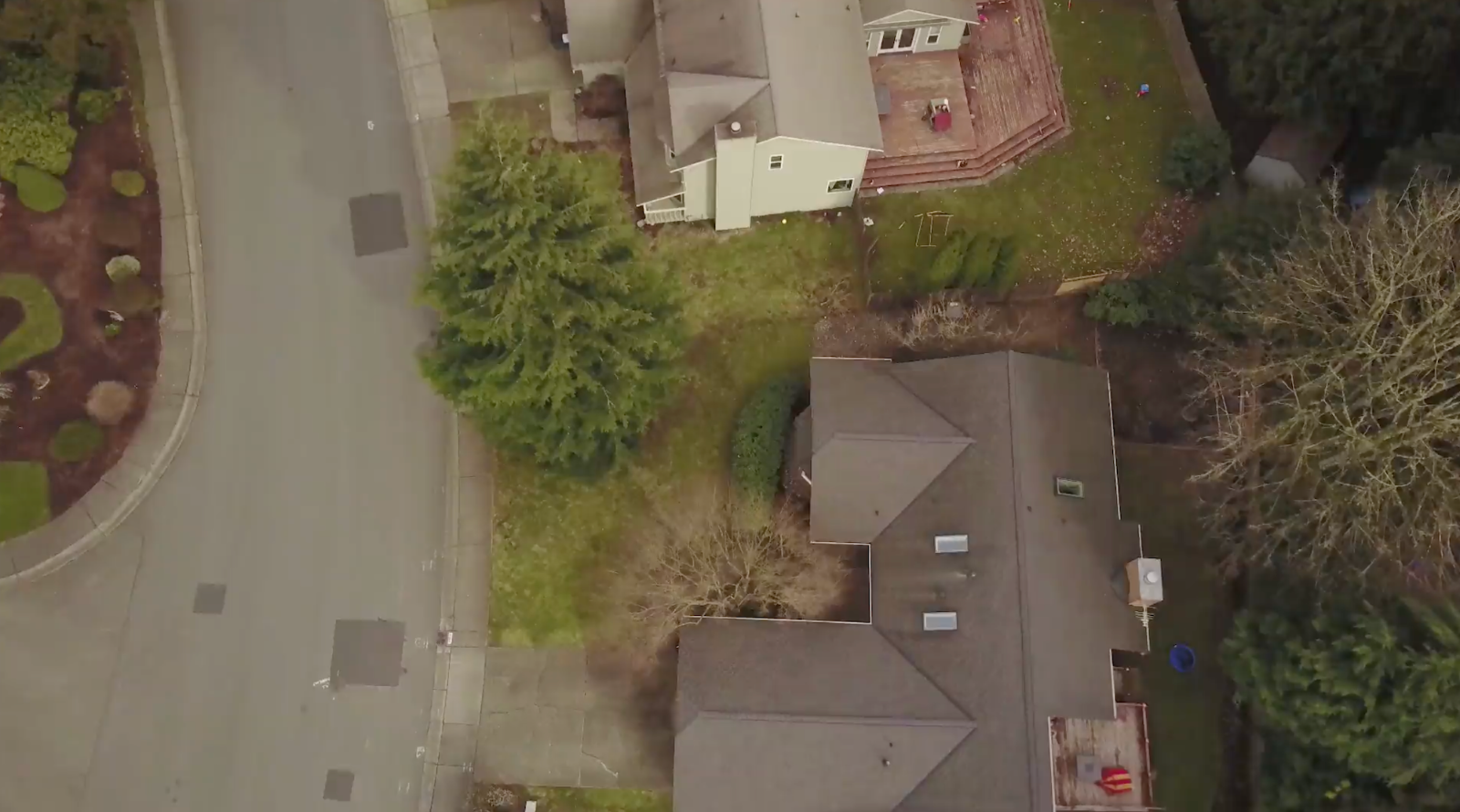 Aerial view of a residential neighborhood with houses and greenery.