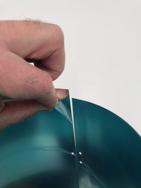 Showing how to remove the blue protective film on the inside of each extension tube. This protective layer needs to be removed prior to installation.