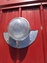 A Solar LightBlaster for Metal Roofs is installed on red metal roof.