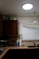 A 14-inch Solar LightBlaster Tubular Skylight for Homes installed in a kitchen.