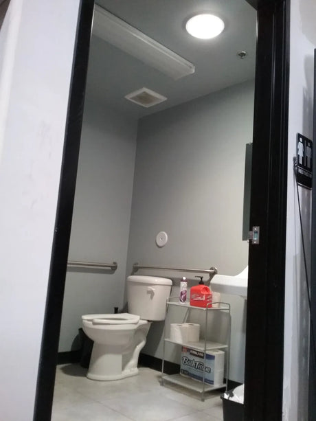 An after photo of a bathroom with a newly installed 7-inch Solar LightBlaster Tubular Skylight for Homes.