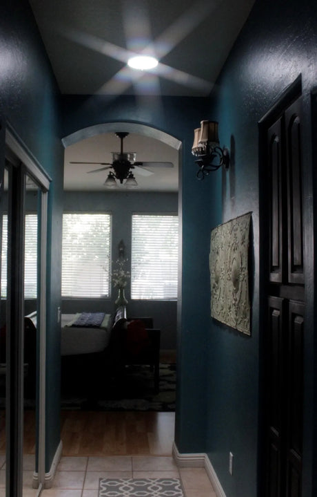 An after photo of a hallway with a newly installed 7-inch Solar LightBlaster Tubular Skylight for Homes.