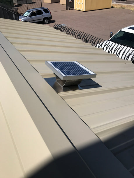 Solar metal RidgeBlaster's solar panel installed on a metal roofed shed.