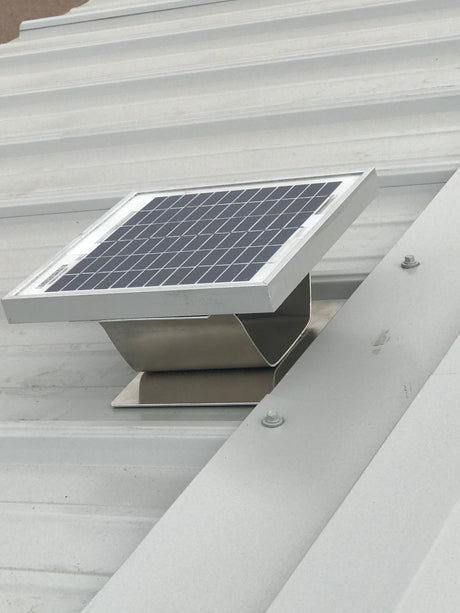 Solar Metal RidgeBlaster installed on a shed's light gray metal roof.