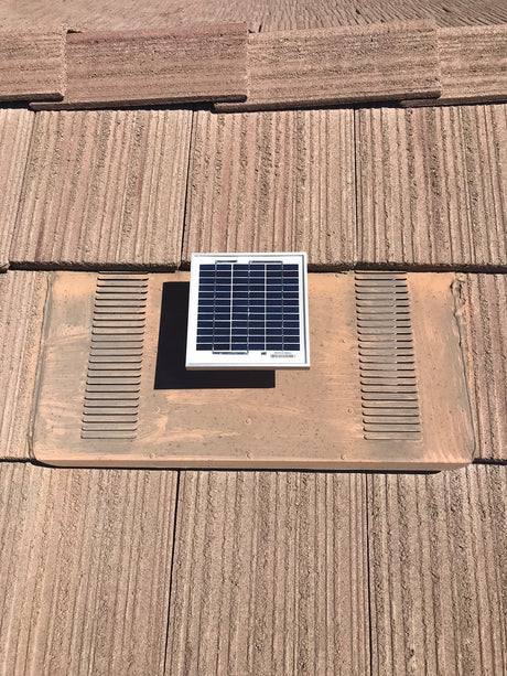 Solar Metal RidgeBlaster installed on a house's roof that has O'Hagin's flat tiles.