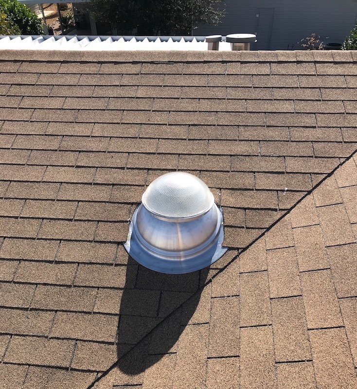 ECOMAX tube skylight installed on brown pitched roof