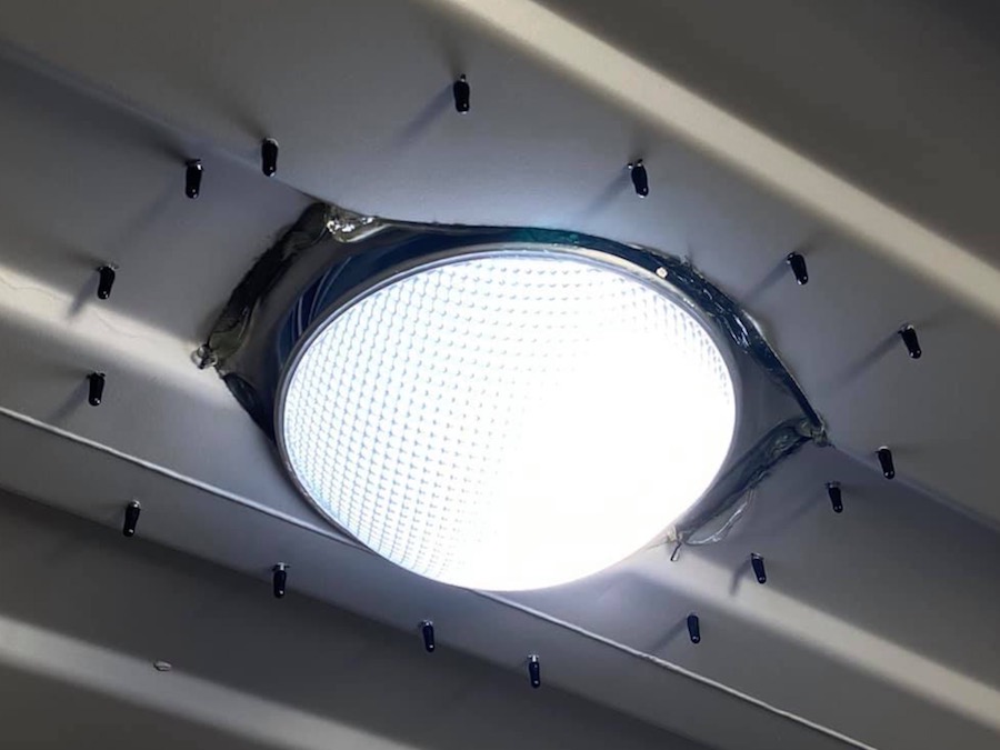 Close up of the inside of a Conex container that has the Solar LightBlaster installed -- we include black caps to cover all the exposed screws
