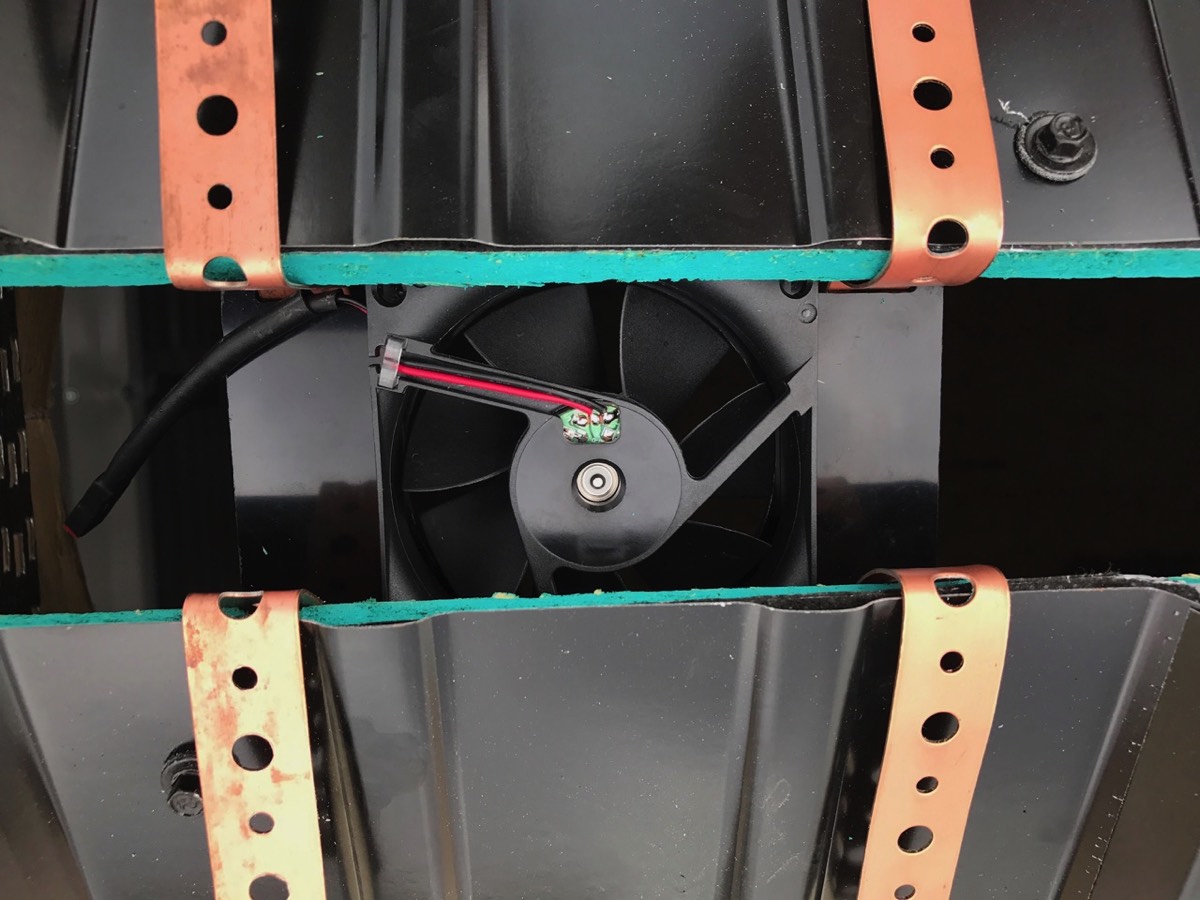 Close Up view of the Metal RidgeBlaster fan unit when installed under the ridge.
