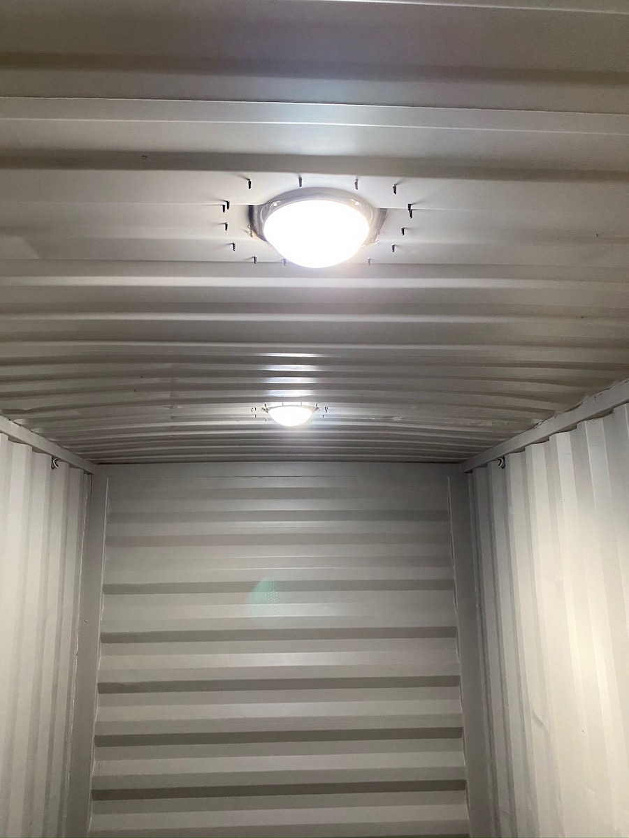 inside view of how much light comes in due to an installed Solar LightBlaster inside a Conex container